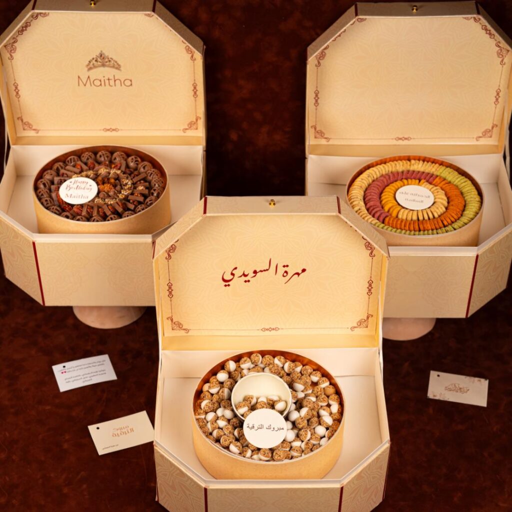 Eid gift box with chocolate-covered dates and pistachio macarons by Fa Le Bon Chocolatier