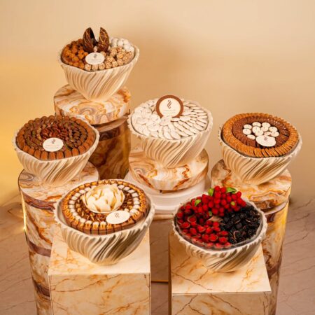 Premium Wedding 6-Tray Chocolate Collection with assorted chocolates, chocolates with fresh fruit, cookies, and macarons, arranged in an elegant round display.