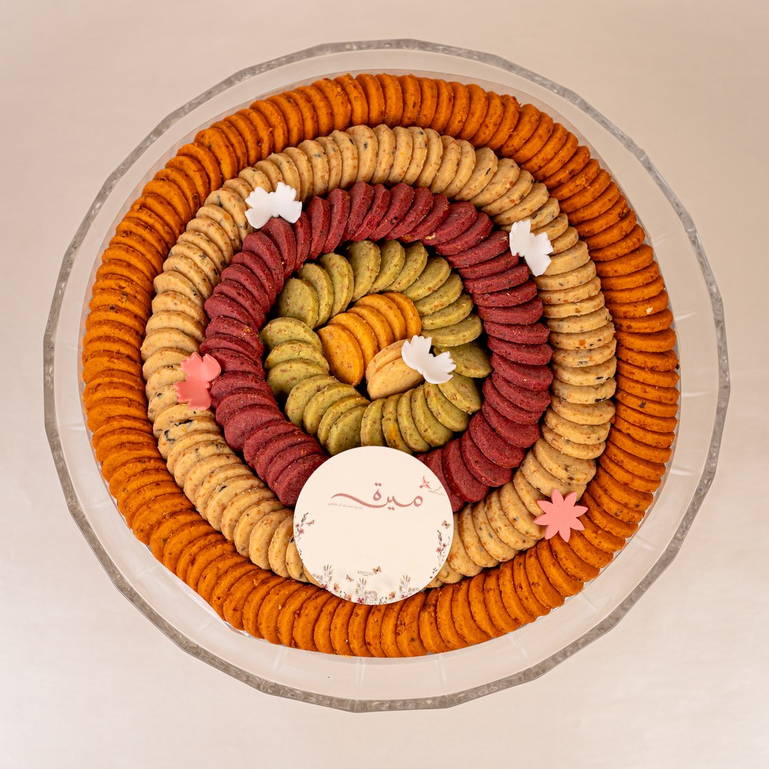 Close-up of red, green and golden cookies arranged in neat rings